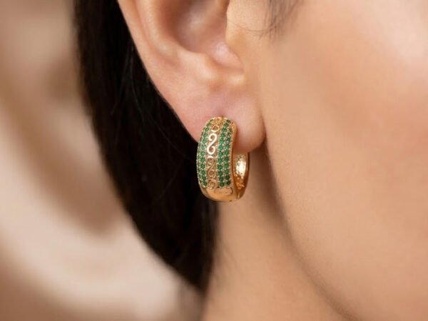 Emerald Grace Hoops featuring elegant green stones with luxurious gold hoop design for women