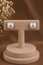 Classic pearls meet modern elegance in these chic square silver studs.