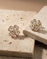 Golden Clover Spark Studs with elegant gold clover sparkle design for women
