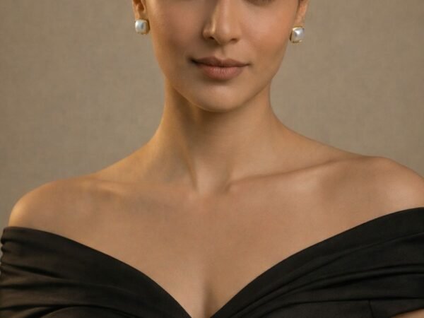 Pearl Aura Square Studs with elegant pearl accents and modern square design.