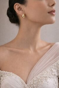 Golden Teardrop Gloss Stud Earrings with sleek polished finish and elegant teardrop shape.