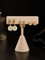Aira Luxe Earrings Set featuring elegant gold statement earrings with a modern and chic design.