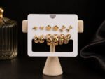 Golden Flutter Multi-Stud & Mini Hoop Earring Set with elegant gold butterfly studs and mini hoop earrings for women