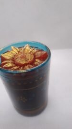 Bring warmth and elegance to your home with this beautiful handcrafted sunflower candle. Featuring a stunning golden sunflower design on rich red gel wax